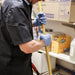 Janitor in Blue Nitrile Gloves Holding Mop 